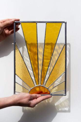 Decorative stained glass panel inspired by the sun, handmade art glass