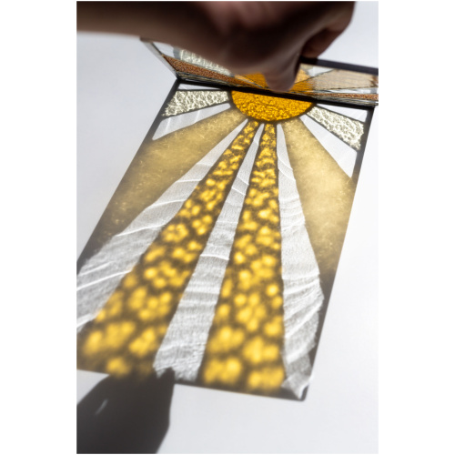 Decorative stained glass panel inspired by the sun, handmade art glass