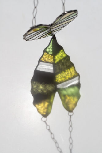 Handmade stained glass suncatcher with alocasia plant design, hanging window decoration