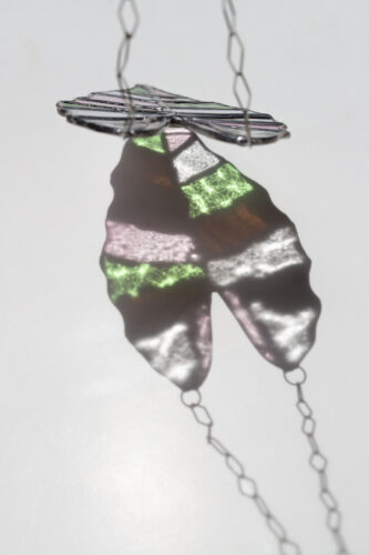 Handmade stained glass suncatcher with alocasia plant design, hanging window decoration