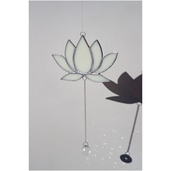 Hanging stained glass window suncatcher in a lotus flower shape made with Tiffany technique.