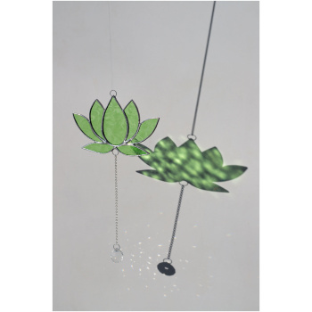 Hanging stained glass window suncatcher in a lotus flower shape made with Tiffany technique.