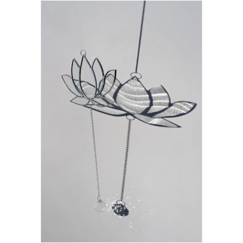 Hanging stained glass window suncatcher in a lotus flower shape made with Tiffany technique.