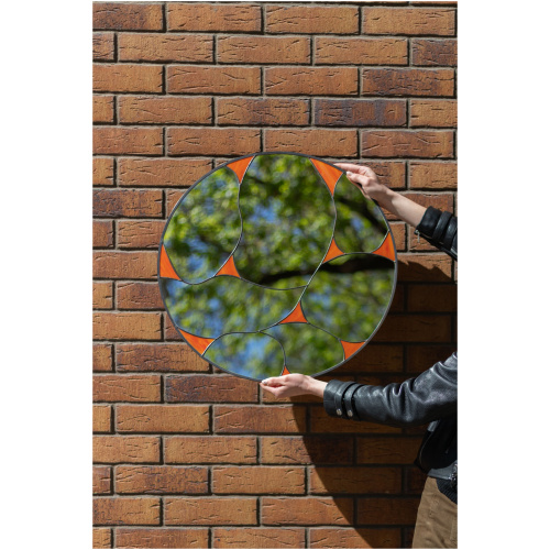 Designer round stained glass mirror featuring a handcrafted fluid pattern and modern artisan metalwork by Duosglass.