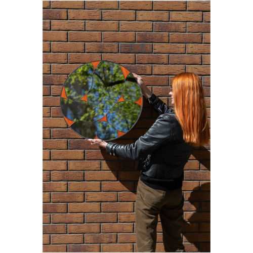Designer round stained glass mirror featuring a handcrafted fluid pattern and modern artisan metalwork by Duosglass.