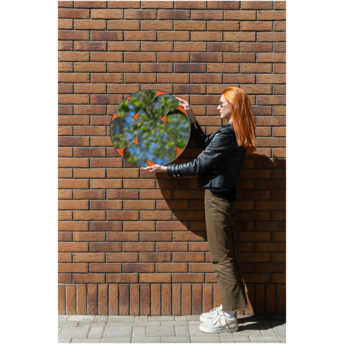 Designer round stained glass mirror featuring a handcrafted fluid pattern and modern artisan metalwork by Duosglass.