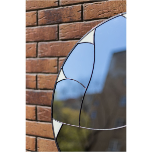 Designer round stained glass mirror featuring a handcrafted fluid pattern and modern artisan metalwork by Duosglass.